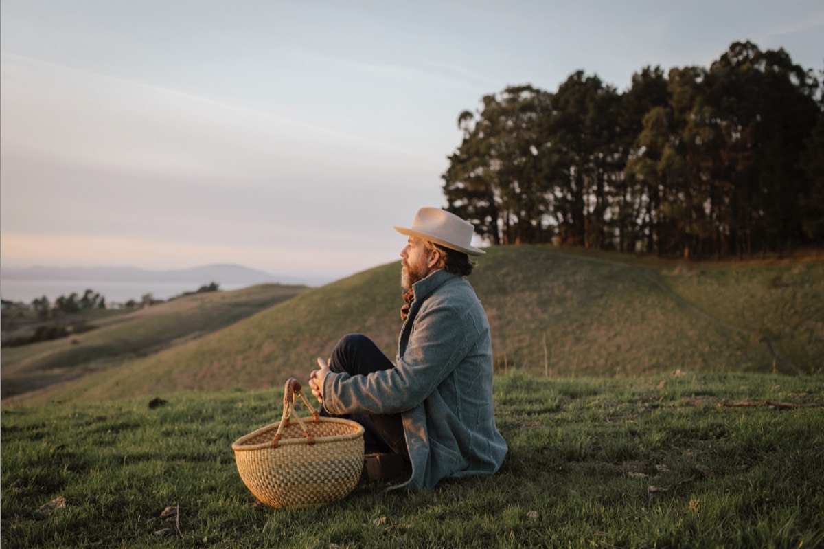 Day Schildkret sitting in nature at sunset with a foraging basket